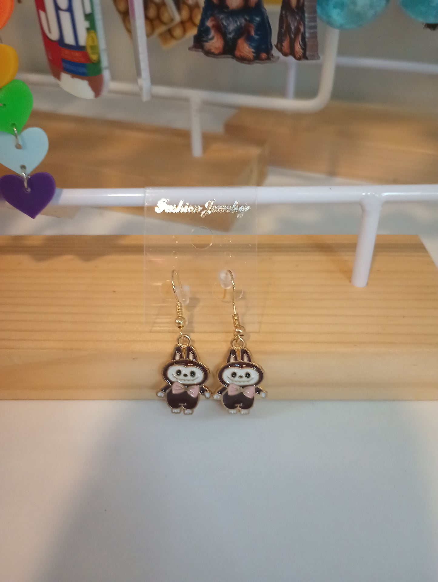 Labubu brown with pink earrings